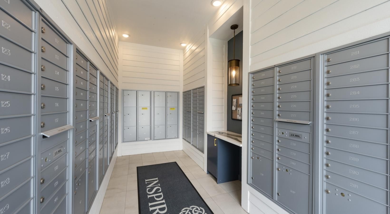 Find your perfect fit at Inspire Missouri City a hallway with white cabinets