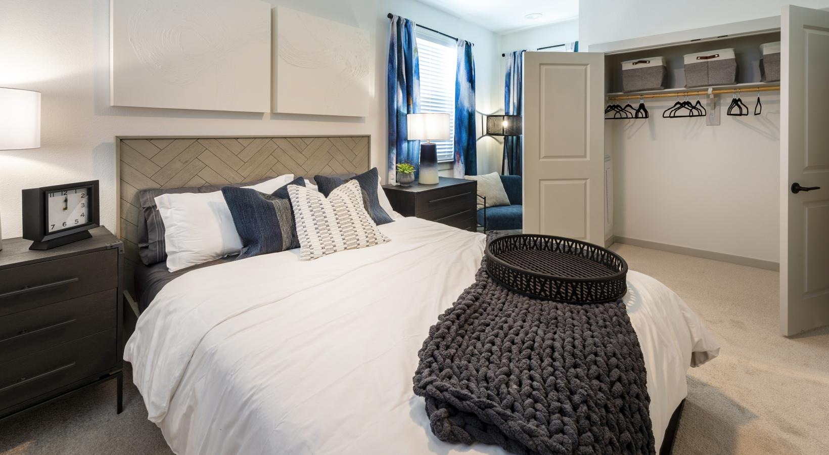 Relax and recharge in beautiful and spacious bedrooms a bed with a blanket on it