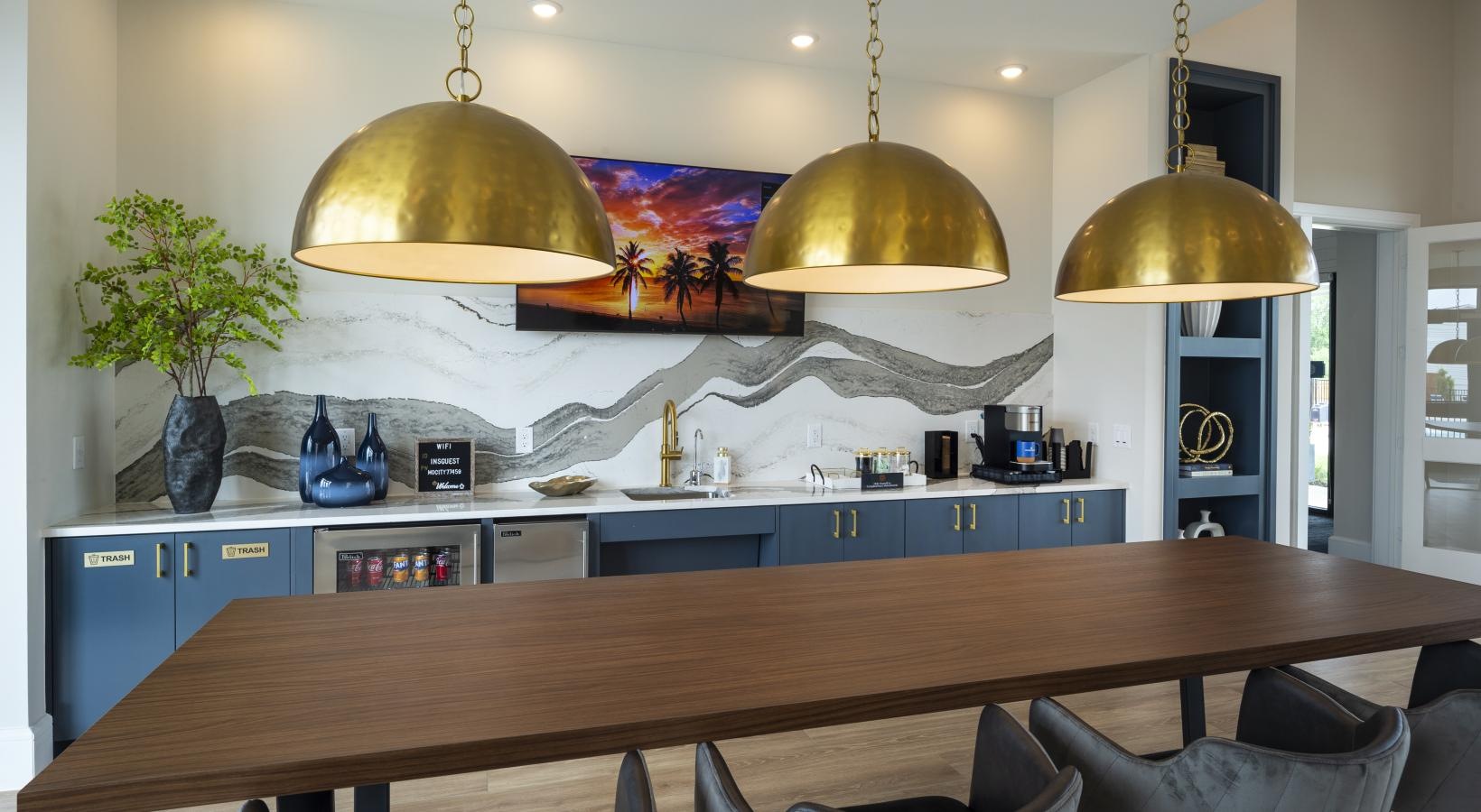 Find your perfect fit at Inspire Missouri City a room with a table and chairs