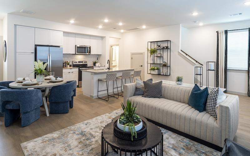 a living room with a couch and a table