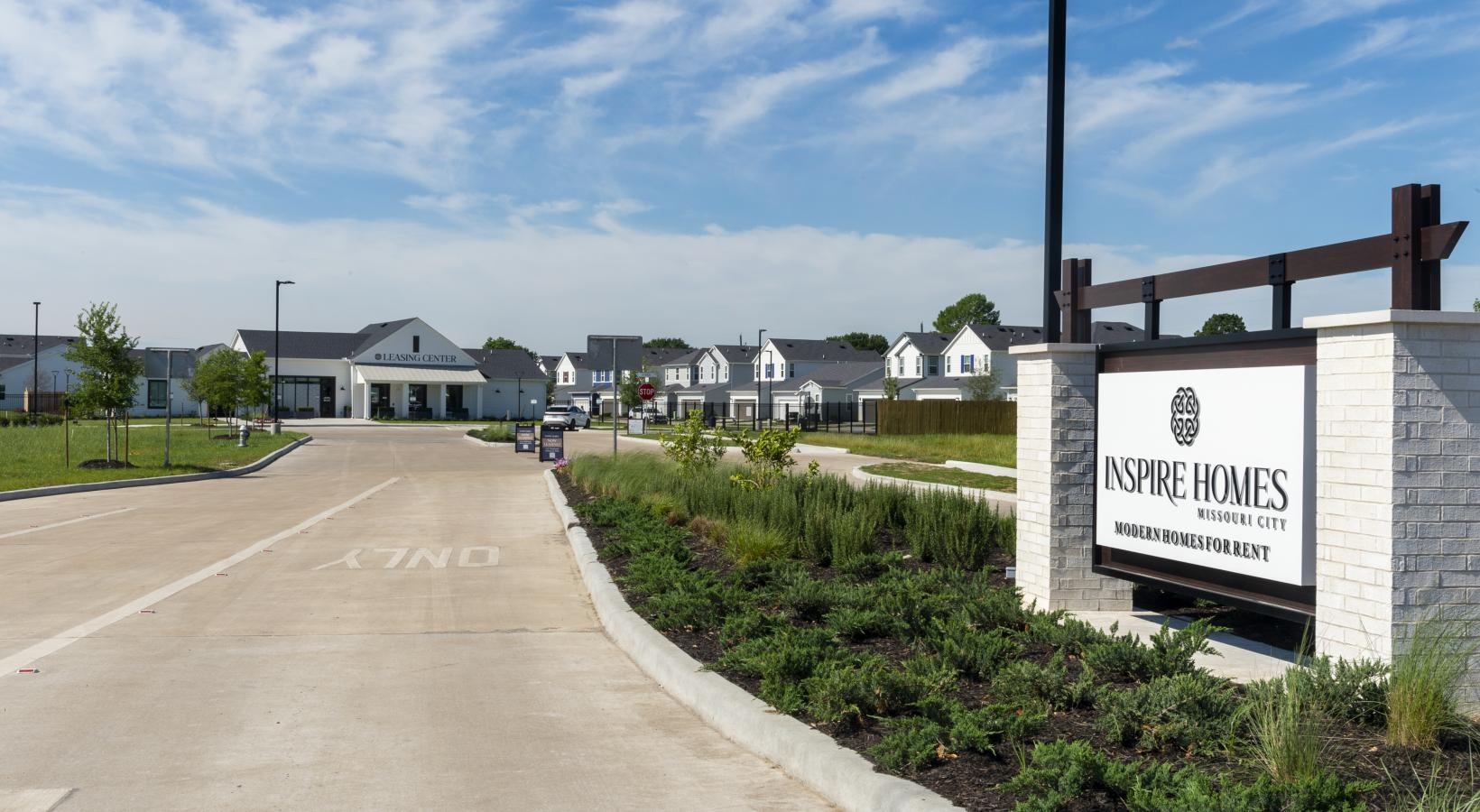 Settle into comfort at Inspire Missouri City a road with a sign on it