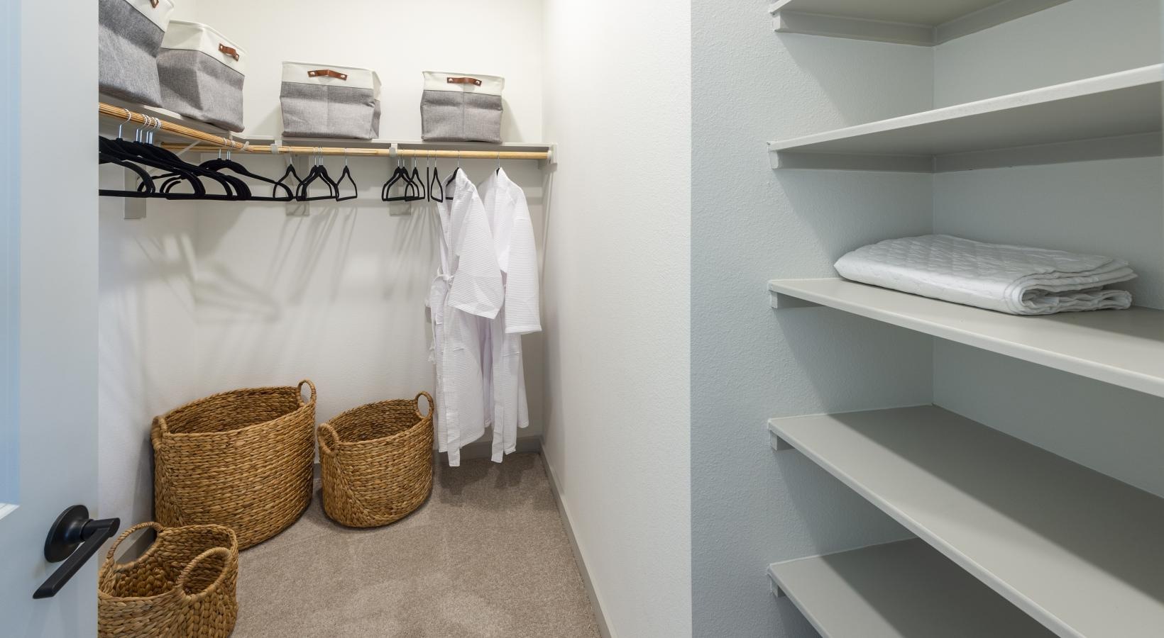 Find your perfect fit at Inspire Missouri City a closet with clothes and baskets