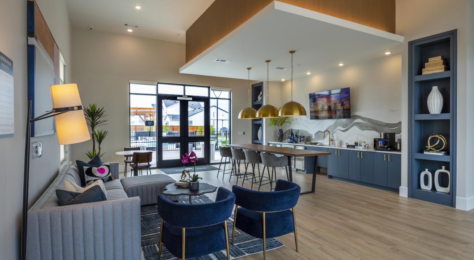 Find your perfect fit at Inspire Missouri City a room with a table chairs and a couch