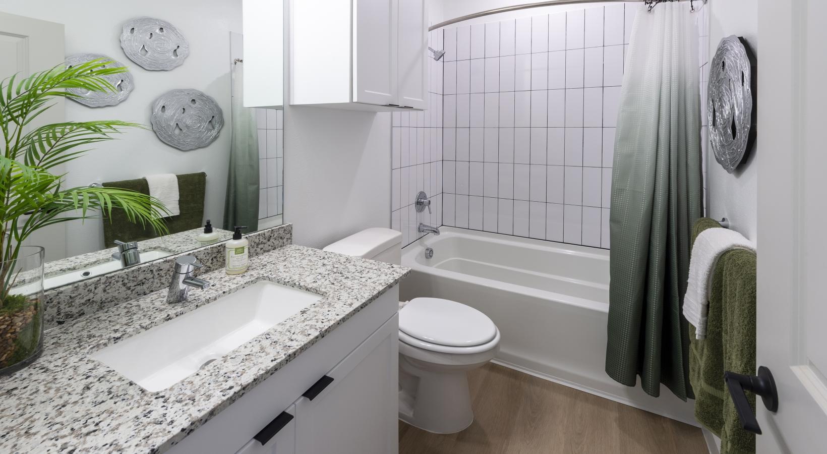 Spacious bathrooms with everything you need a bathroom with a sink toilet and a shower