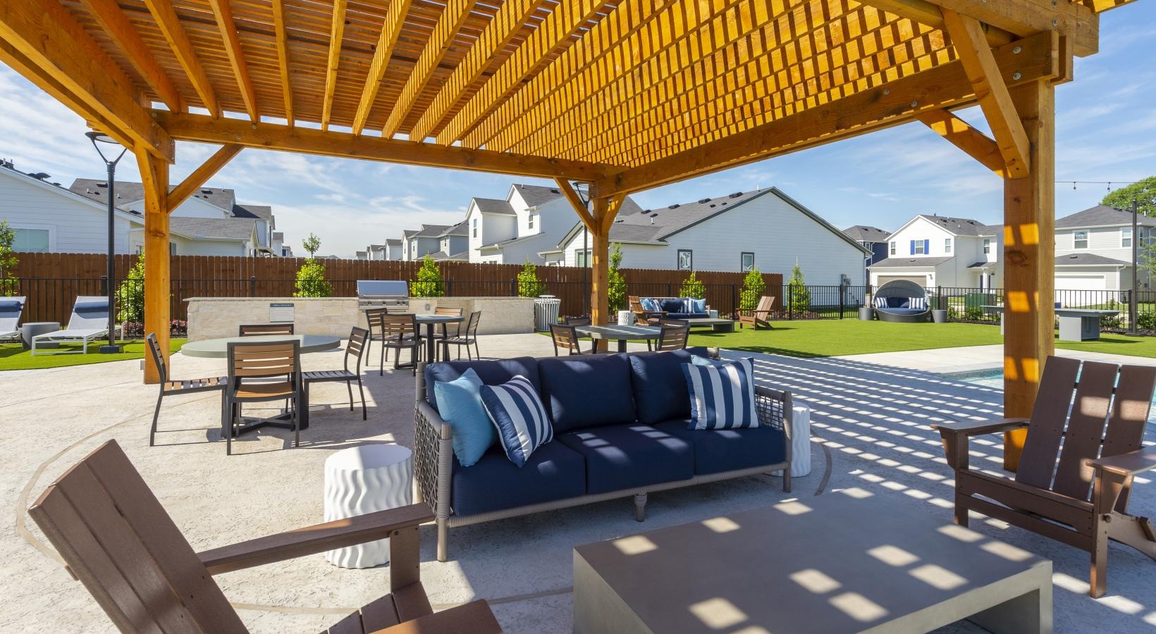 Find your perfect fit at Inspire Missouri City a patio with a couch and chairs