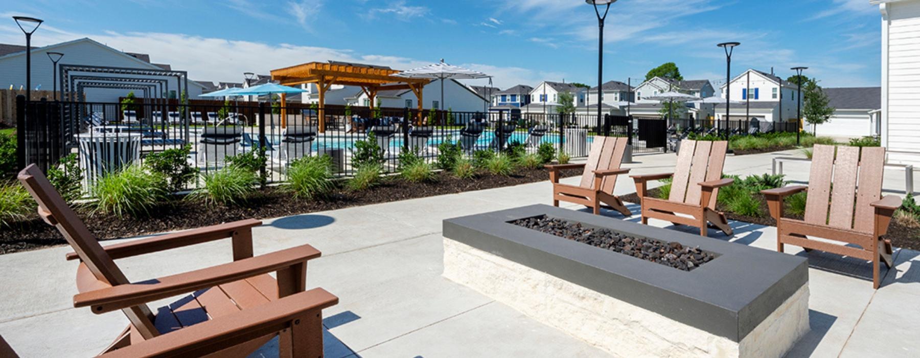 a patio with chairs and tables