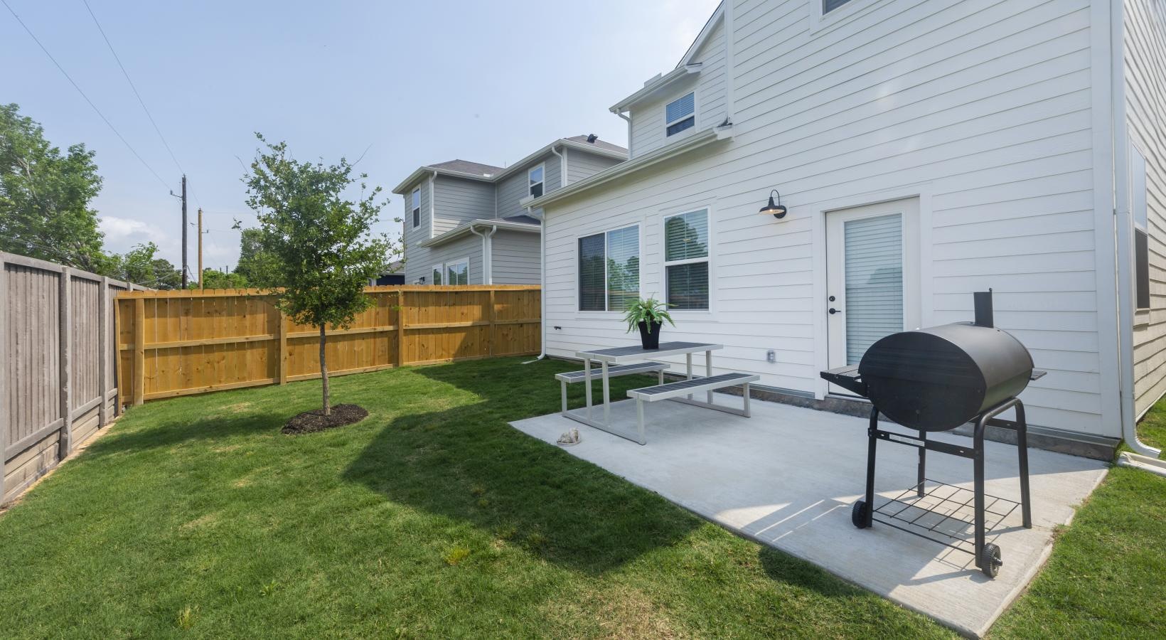 The essence of exceptional living a backyard with a barbecue