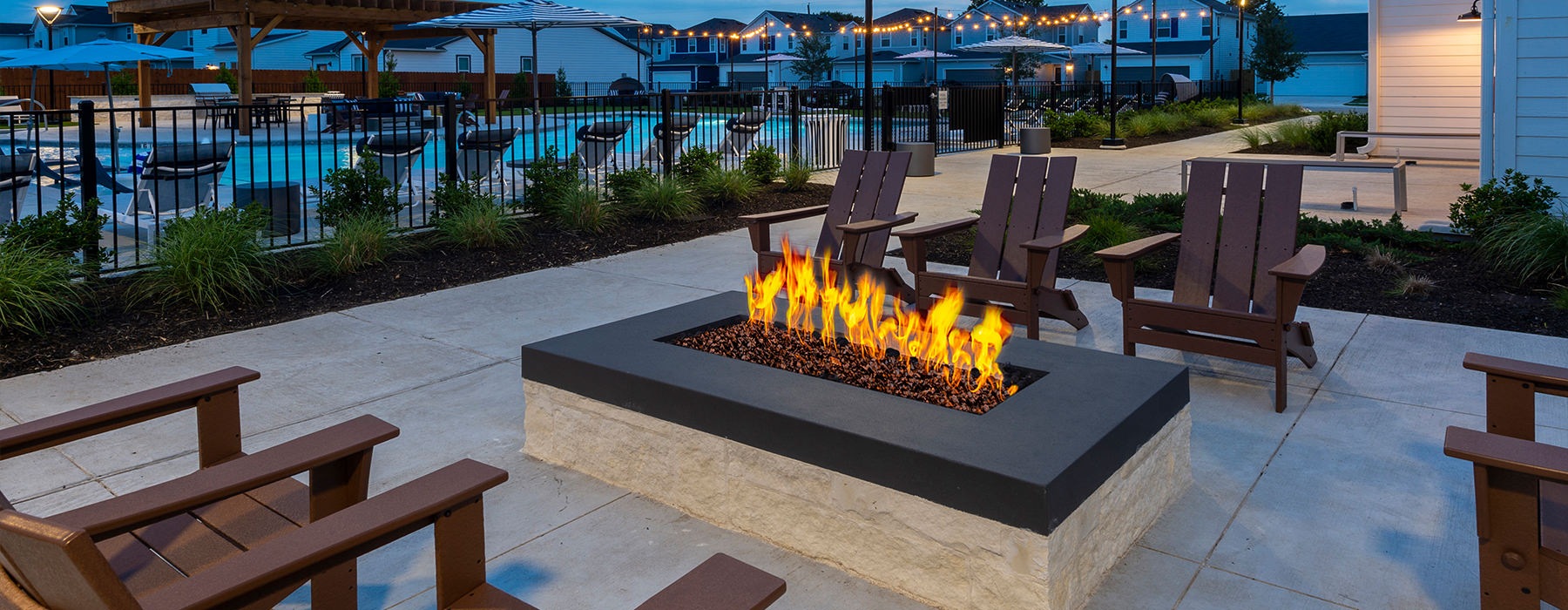 a fire pit with chairs around it