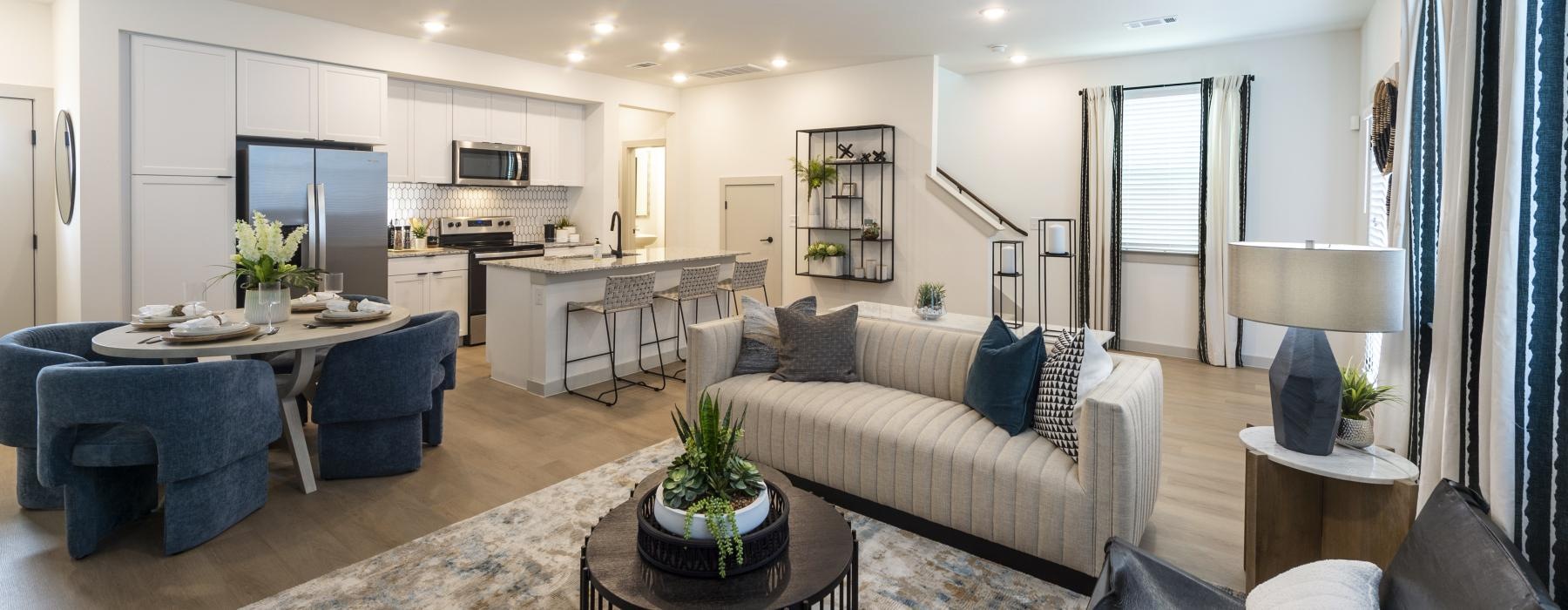 a living room with a couch and chairs